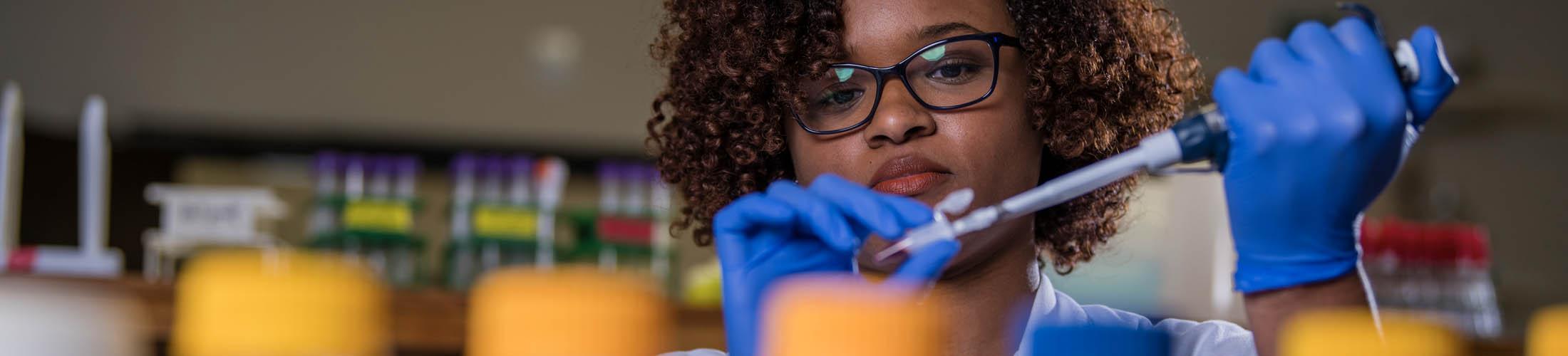 Female student working in lab.